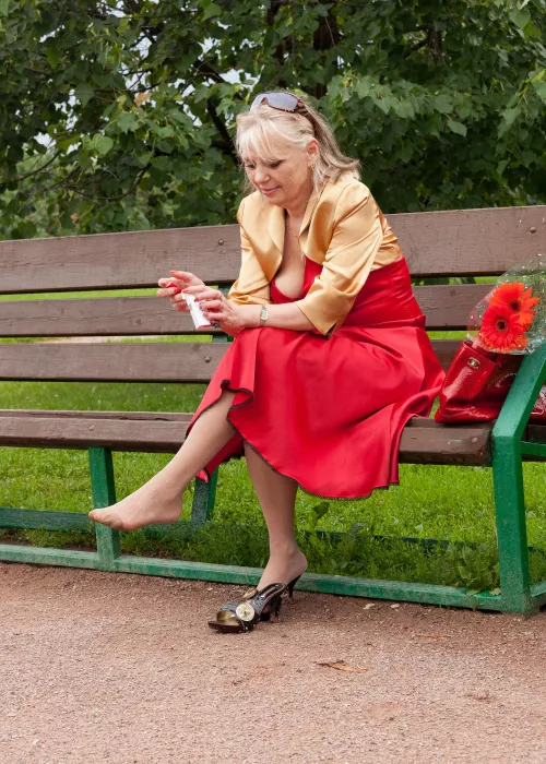 52 y.o. lady in red and yellow in the park by sexyfeetexpo