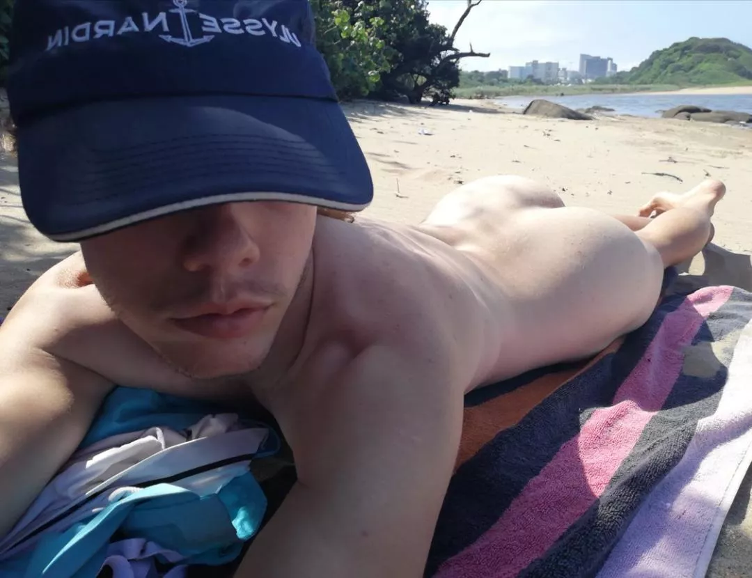 a mild softcore peek from my content of me being cheeky on the beach posted by Local-Dish7067