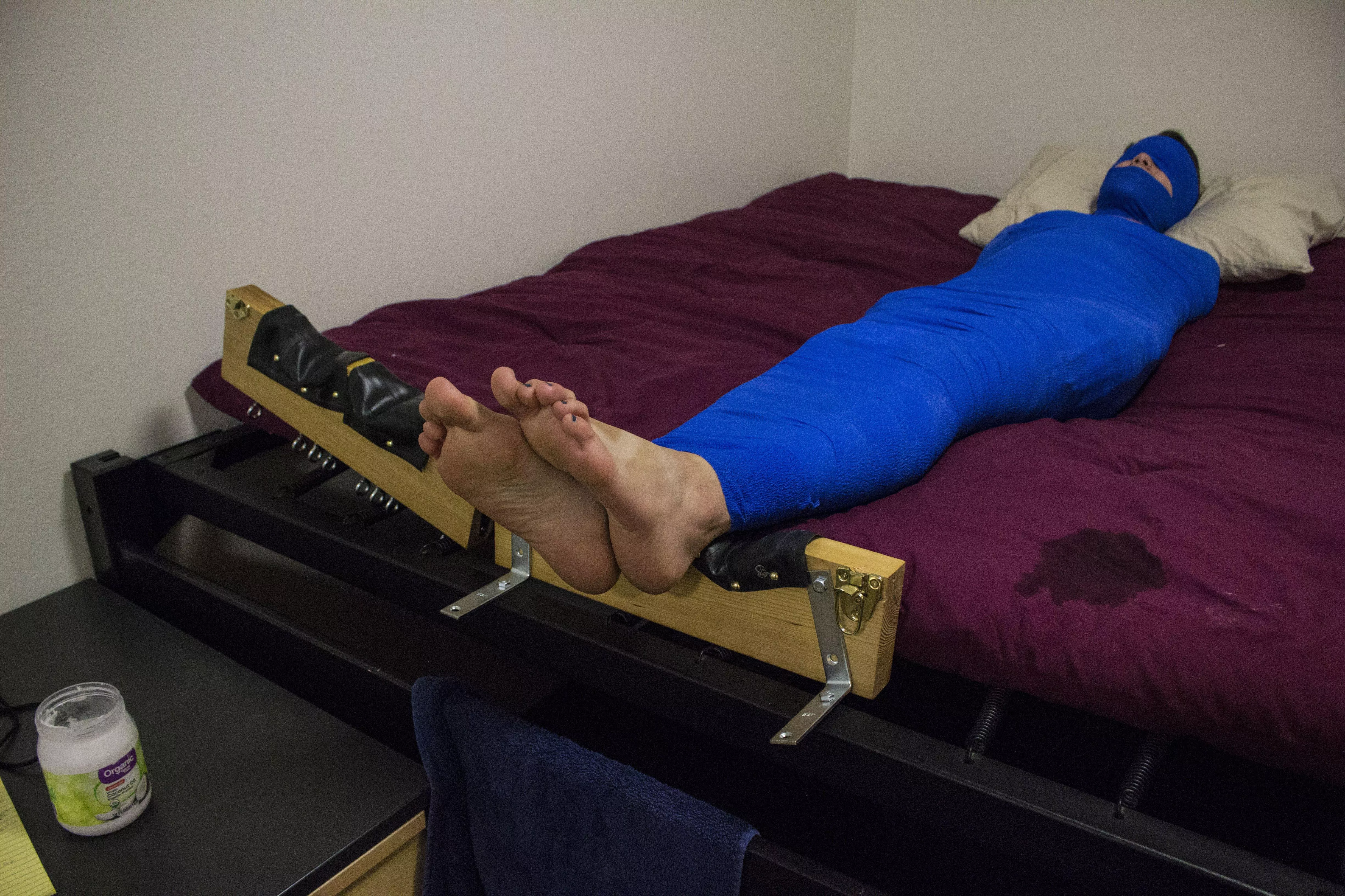 Behind the scenes of a short break before being locked facedown for more tickling! OC posted by cashewfeet1