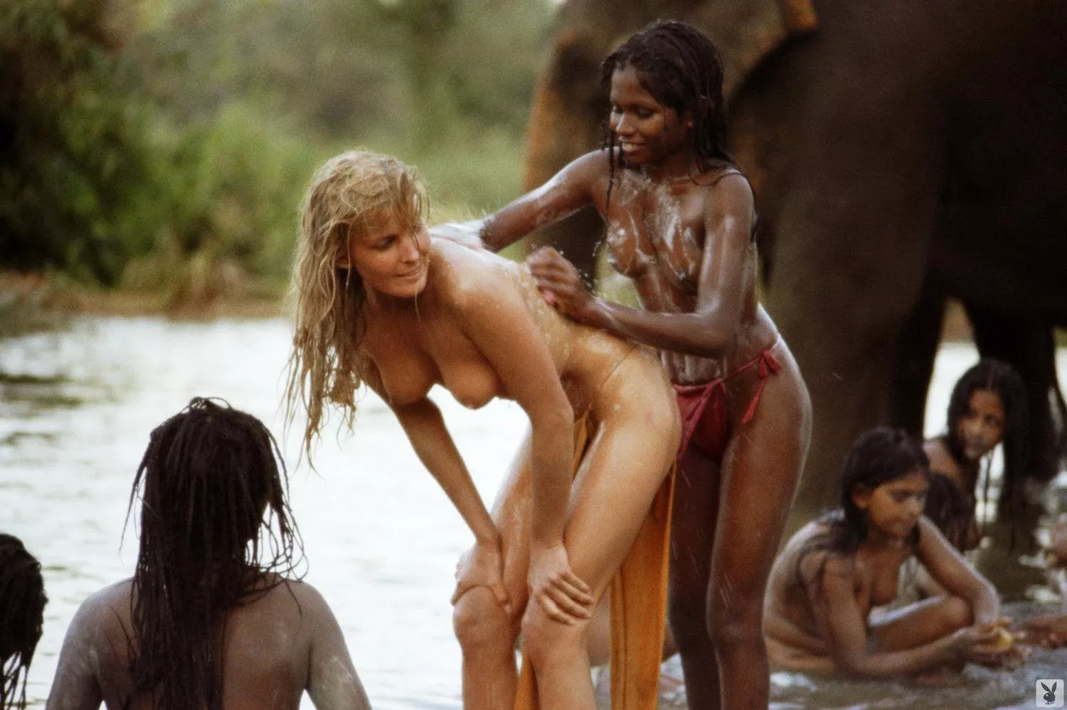 Bo Derek -- BTS of Tarzan the Ape Man (1981) Being washed down by a native after the famous white paint scene. posted by deputyduffy