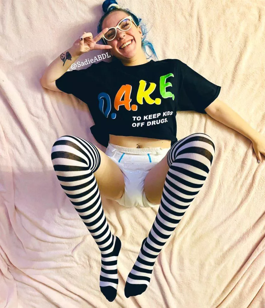 Comfy cozy in just a diaper, t shirt and socks 💗 Rolling around on the floor without a care in the world posted by SweetbbSadie