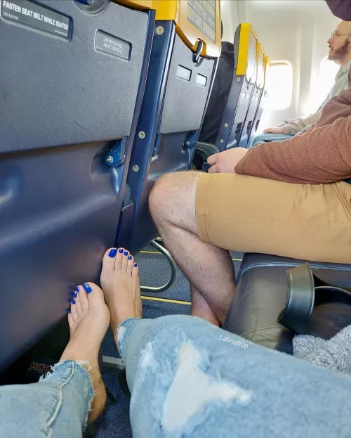 Feet in fun places as the passenger beside me was snoozing by Latinaft00