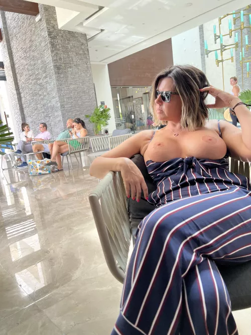 Hanging out in the lobby waiting for our room by JaneTheExhibitionist