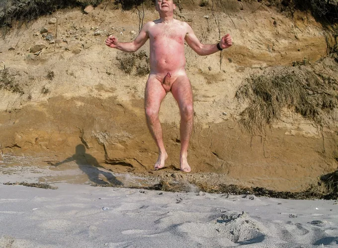 jumping to get warm after my coldwater swim (notice the lobster tan) by Temporary-Ad4509