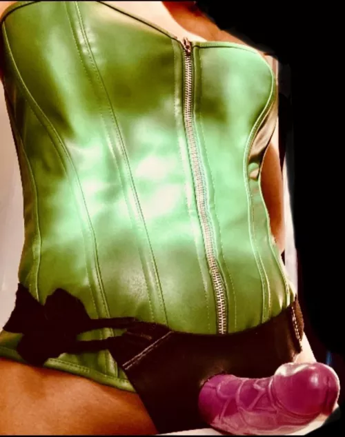 Leather corsets and strapons go together almost as well as purple and green! Now let’s cut to the chase, face down ass up and be a good boy 😈 by Poisonivy309