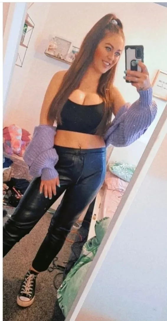 Leather trousers, messy room, tits out. Definite chav. posted by 77651234