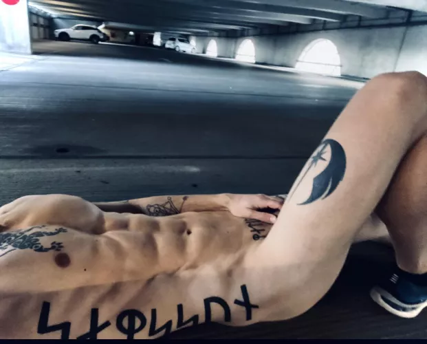 Lying naked in a car park. Sure i’m being watched by GreatDane85
