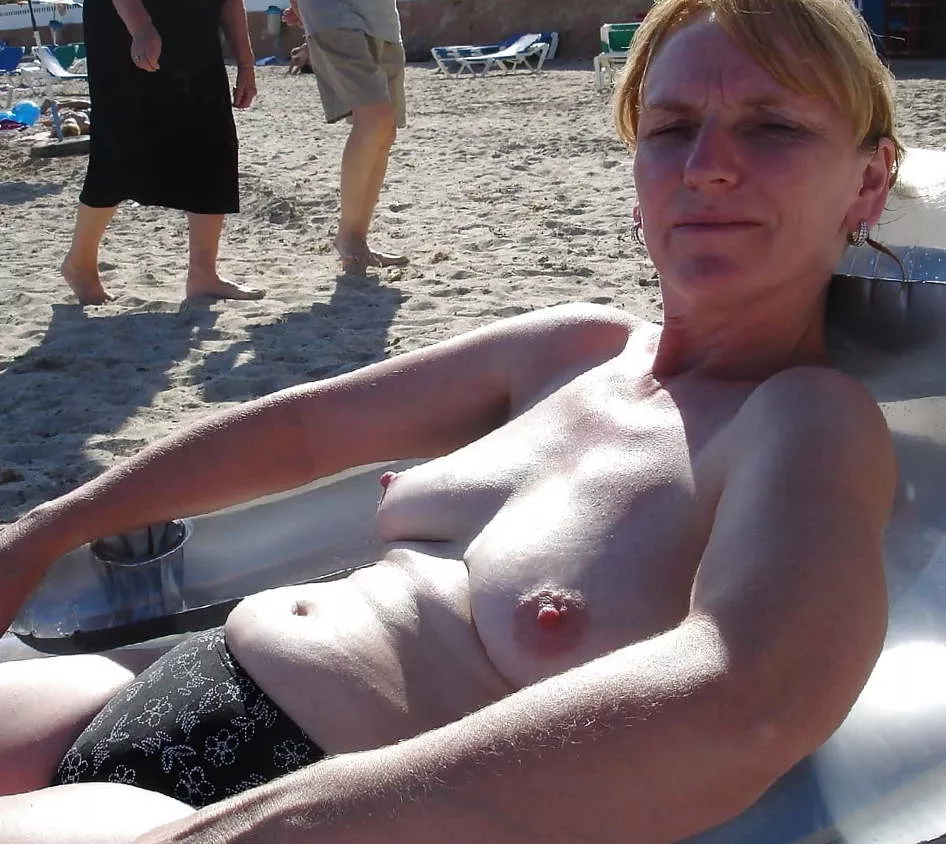 Mom is always alluring at the beach with that belly and those succulent sagging tits posted by bustingbubble