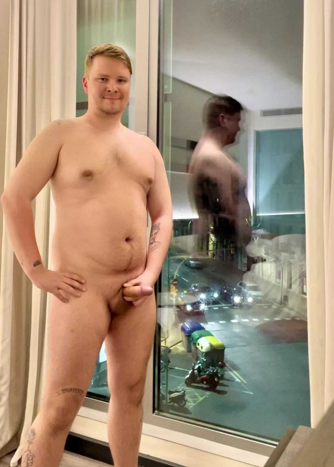 Night time, busy street, big window, lights on, happy exhibitionist posted by 71836