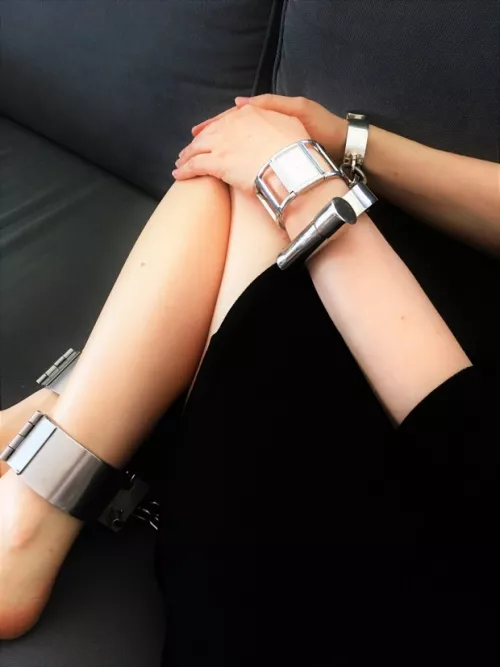 [OC] I have to be chained if I want to watch TV - Darby cuffs and ankle manacles [F] by JessicaShackled