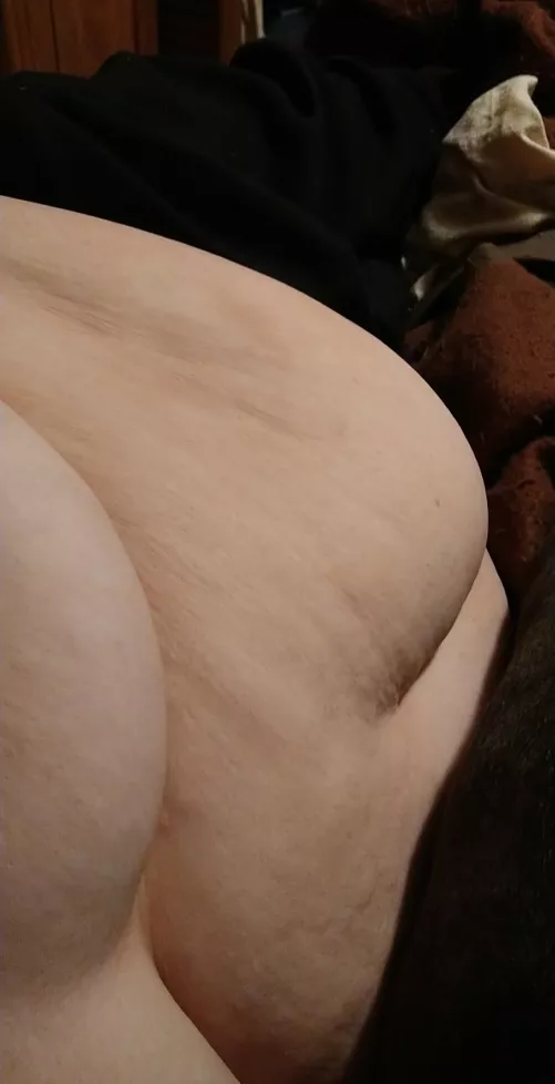 One thing I've discovered is that sometimes people just want to see my belly when I'm laying on my side. To see the little divot it makes I guess. Here's yet another belly pic. by fatandhotforyou