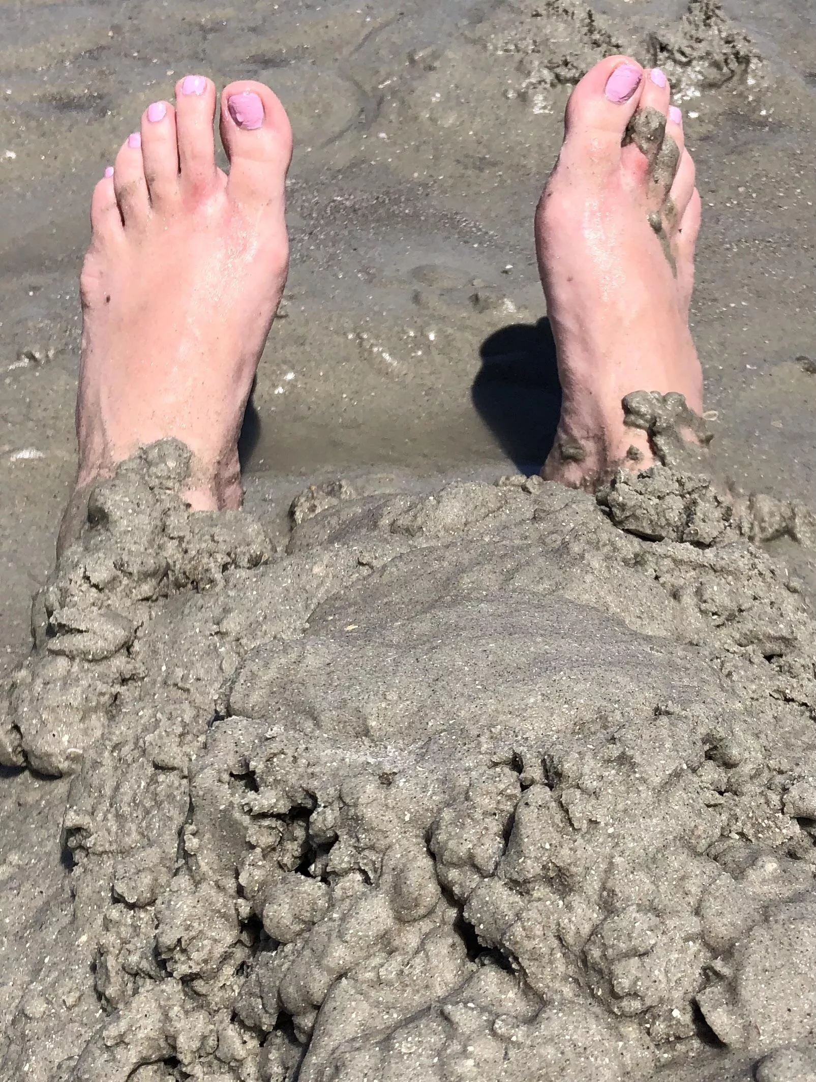 Only my vulnerable feet showing as I’m buried in wet sand at the beach! posted by FootsieGirlJ1