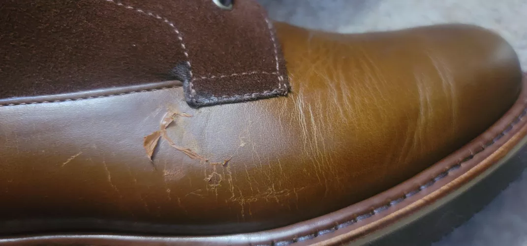 Peeling coating or something on leather of boot? by Wyzen