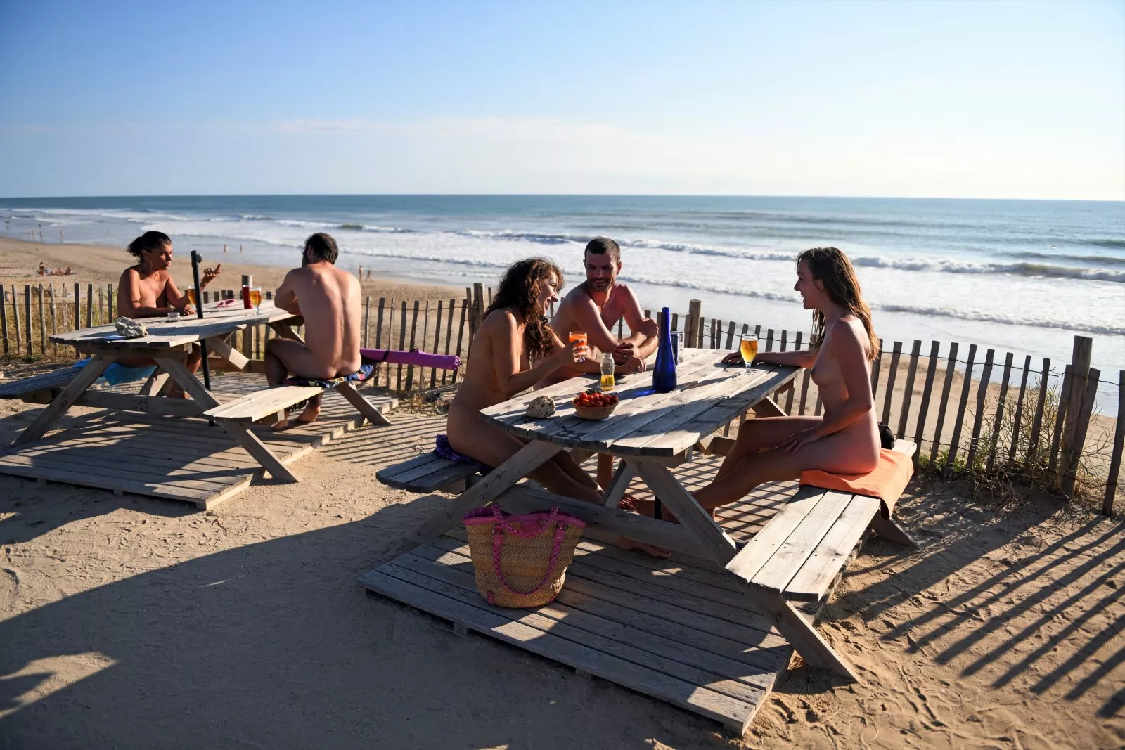 Picnic tables near the south beach at Euronat, France. posted by NaturistPictures