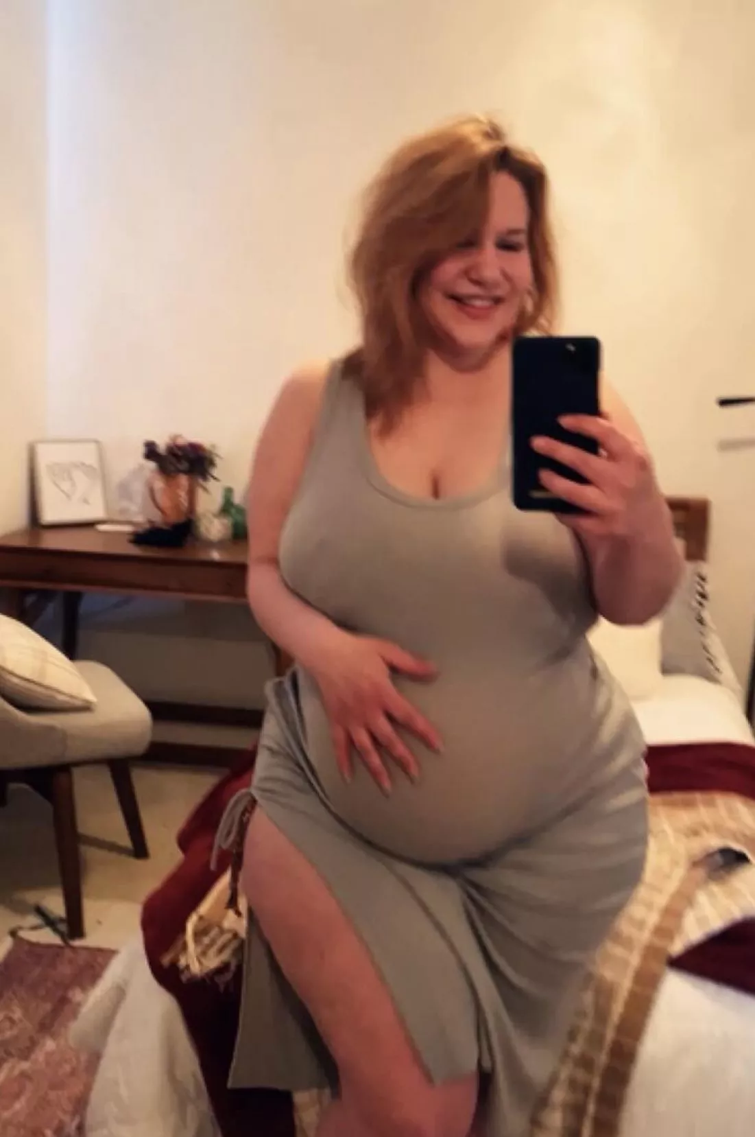 She got a Belly under those Clothes. posted by FeedHerGood