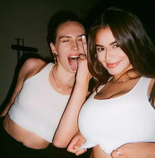 Stretching her top by Ok_Strawberry_6446