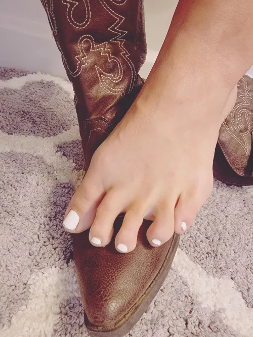 taking my boots off after a long hot day by Flirtyfeet247