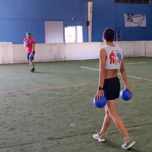 Took this of my husband (left) during our LGBT dodgeball tournament and I'm at a loss for words. I need a caption. by banjoboyslim