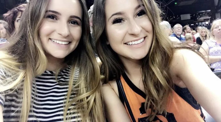 Which sister is putting her mouth to work in the stadium bathroom? [2] by athletebabes