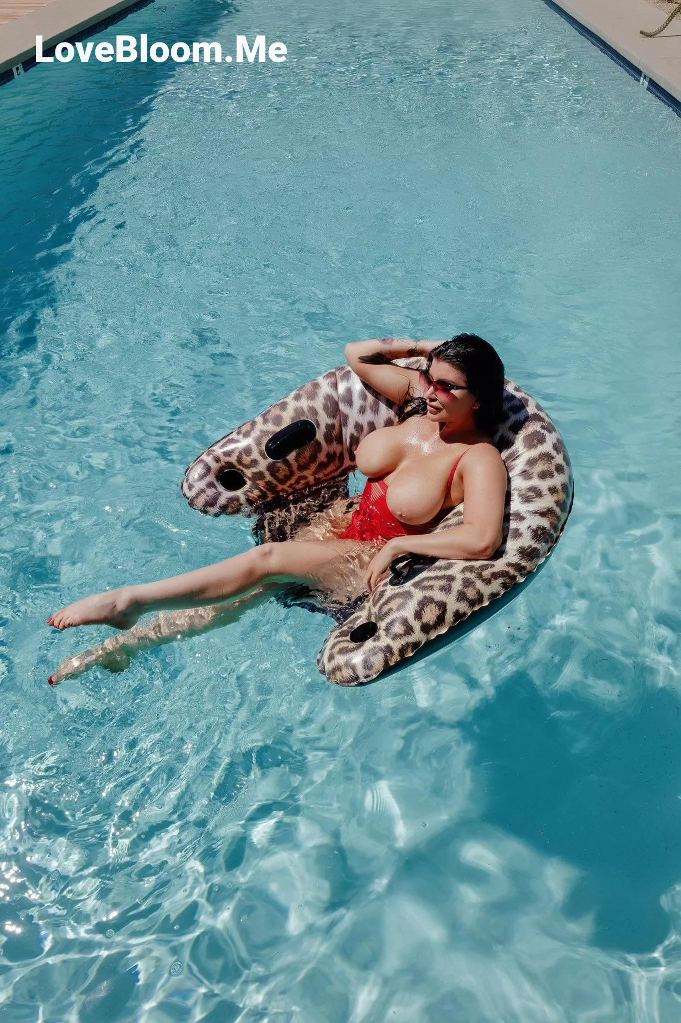 Chilling in the pool with her tits out posted by Pristine_Regular1433