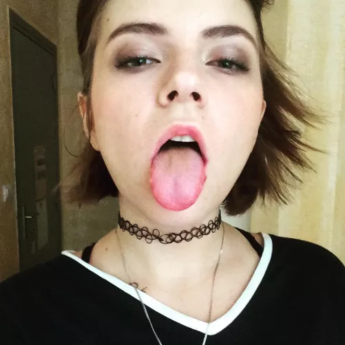 Sticking her tongue out by SarasCaptions