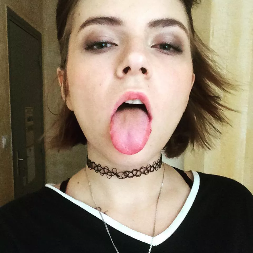 Sticking her tongue out posted by SarasCaptions