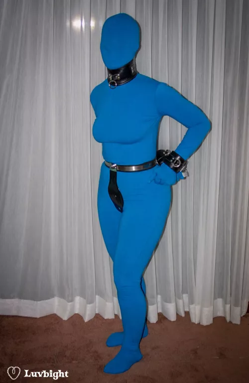 There's something you don't see every day... Dee Luvbight belted, cuffed, and collared in a Zentai suit. June 2002. by MickLuvbight