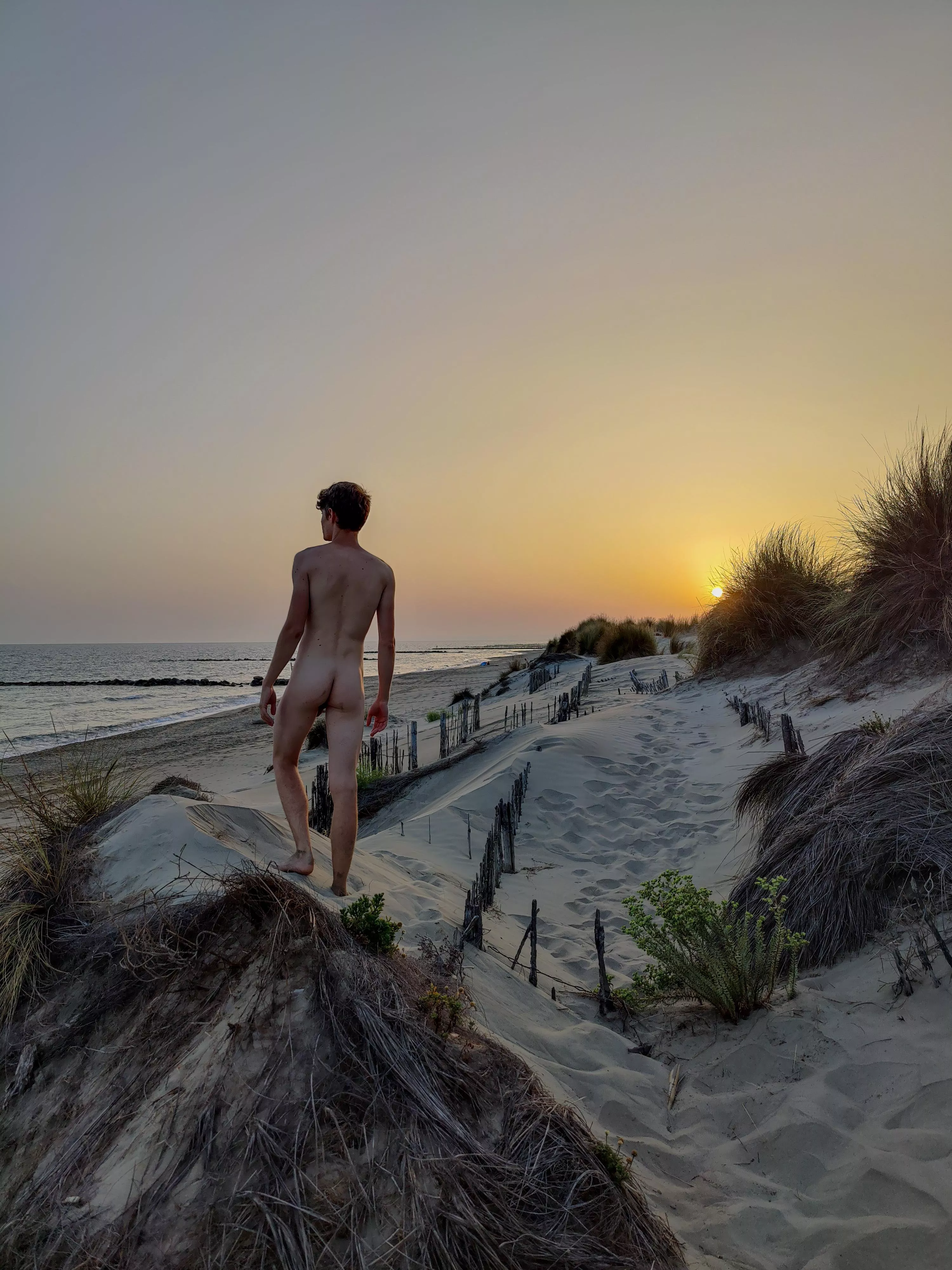 July 17th, 8:59pm. When you're the last one at the nudist beach, at first you feel like you shouldn't be there. But, as the sun sets, you slowly feel like you become part of nature * - * posted by Topotopotopotopot