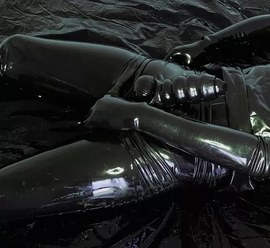 Completely encased in several layers by AnonRubberGuy