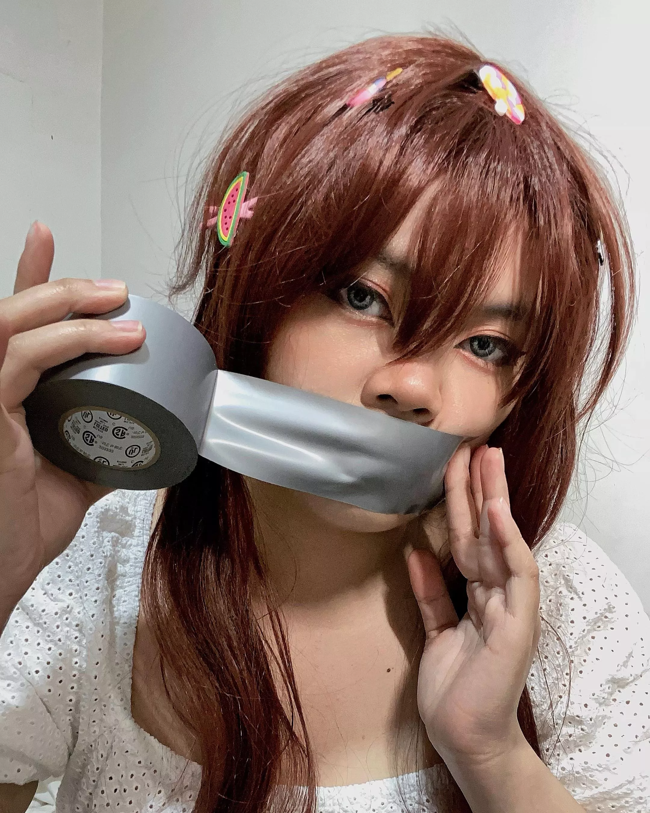 Dont mind her, she’s just playing with her favorite tape while I get the rope. posted by Bondage_enthusiast