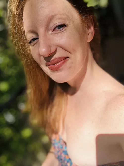 Enjoying the sun and a nip slip by RedAfricanButterfly