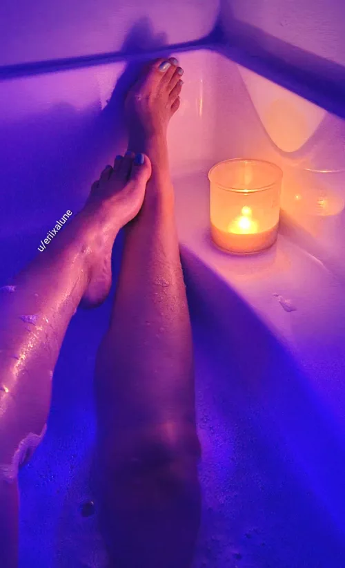 Relaxing in a warm bath while it's storming outside by eriixalune