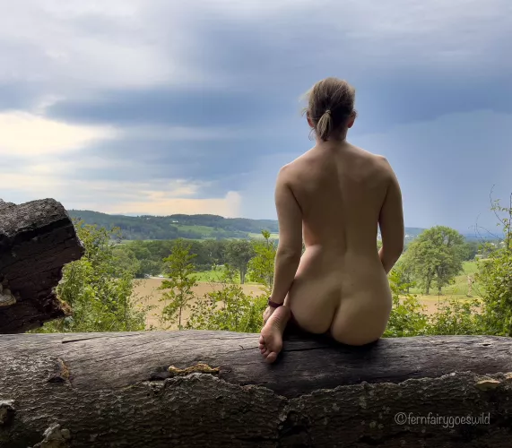Nudist (OC) watching the storm in the distance by Fernfairygoeswild