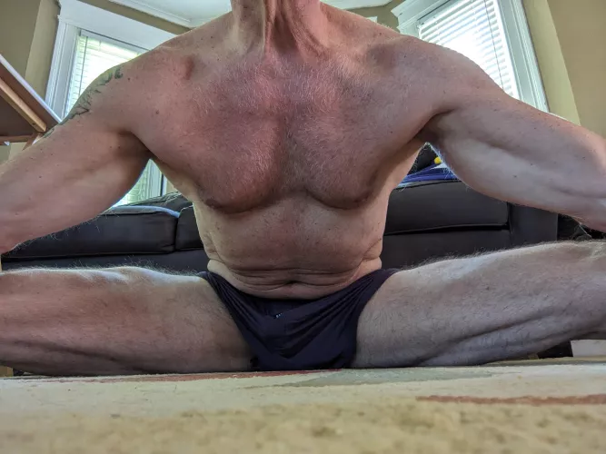 (58) stretching while watching some college football by waters_way