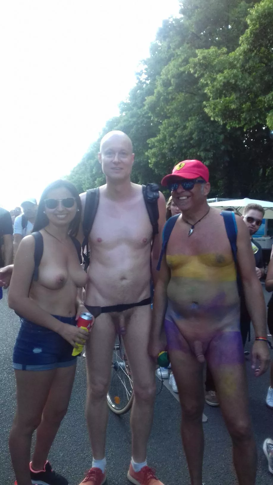 At Pride Berlin 2019 with a nudist friend and a topless lady (I am in the middle), picture taken by her boyfriend, more of my public nudist adventures + videos: mynudistlife.wixsite.com/bart enjoy/share! posted by AromaticChoice9627