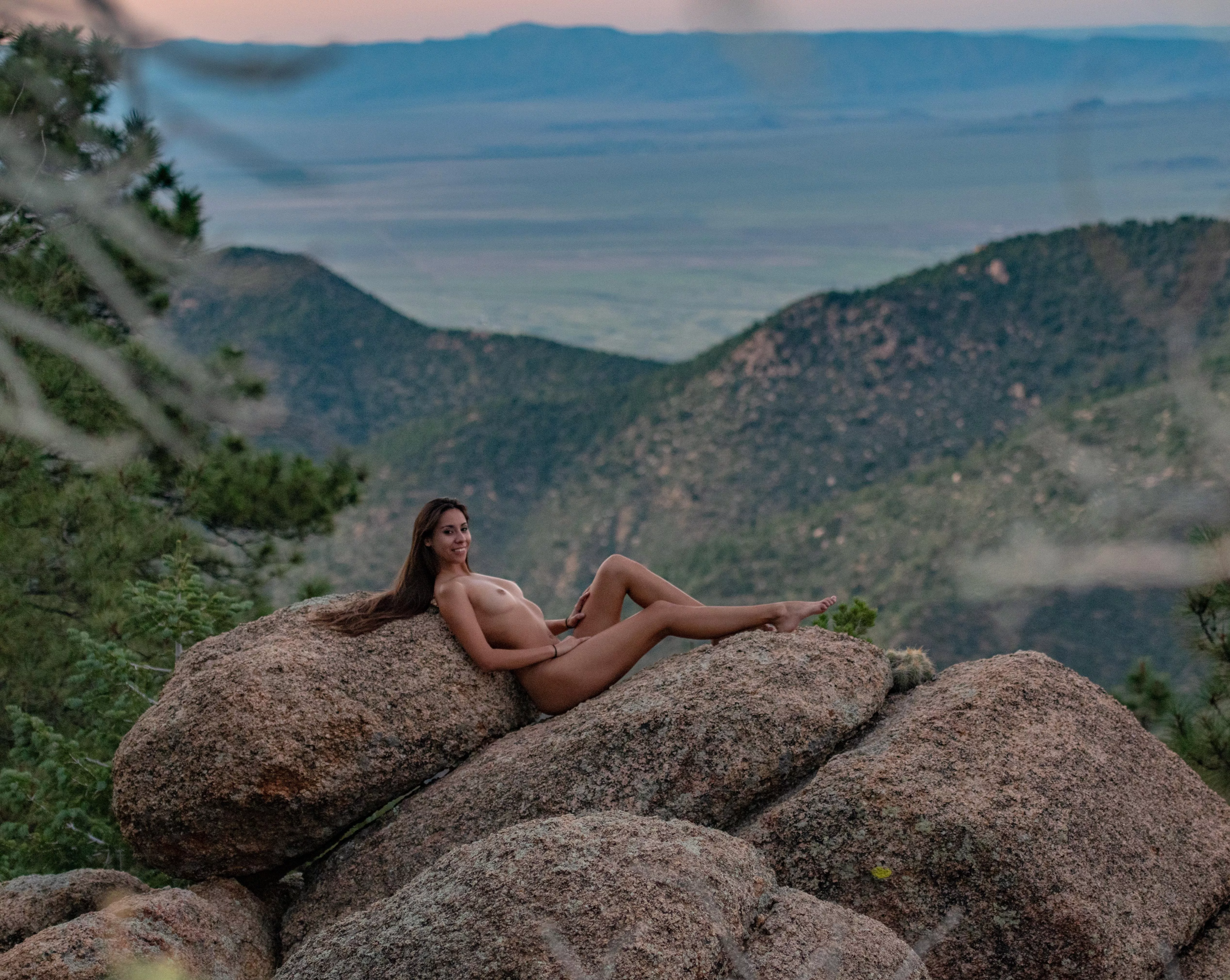 My friend took this picture of me posing naked on these rocks while our boyfriends watched us. posted by YummyHoneyyy