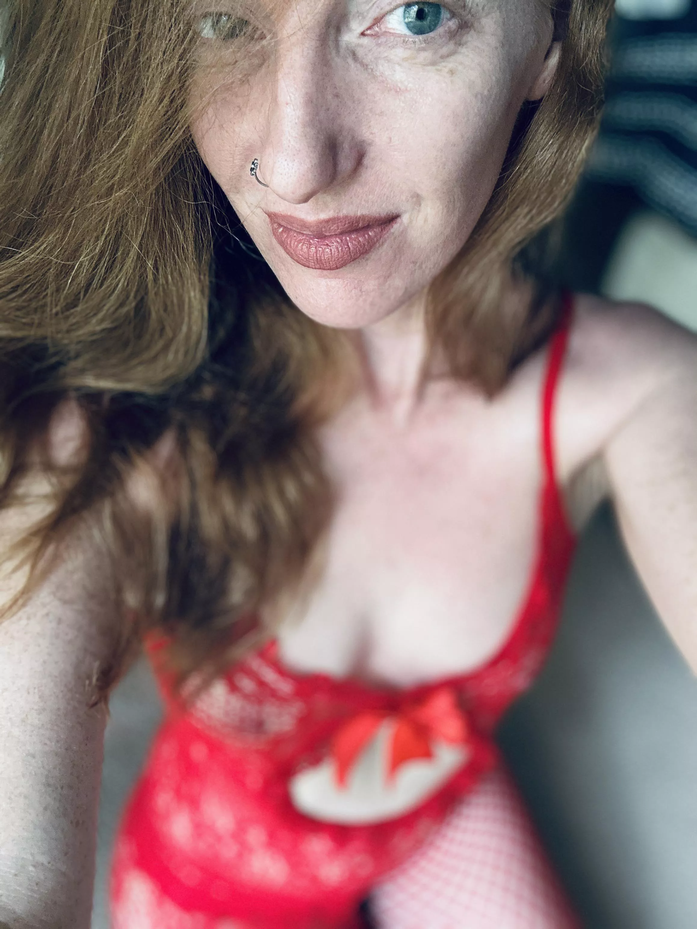 Red fishnet body stocking on a redhead with hazel eyes. posted by RedAfricanButterfly