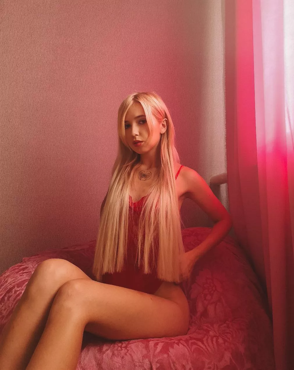 A blonde woman with long hair and wearing red posted by swweet_candy