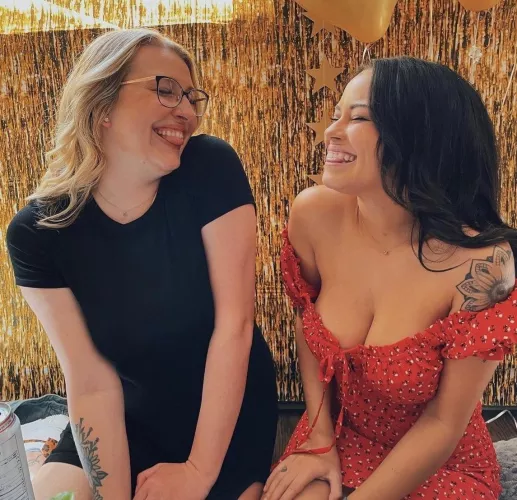 Do you think the girl on the right knows her top is falling down ? by Free-Ice9696