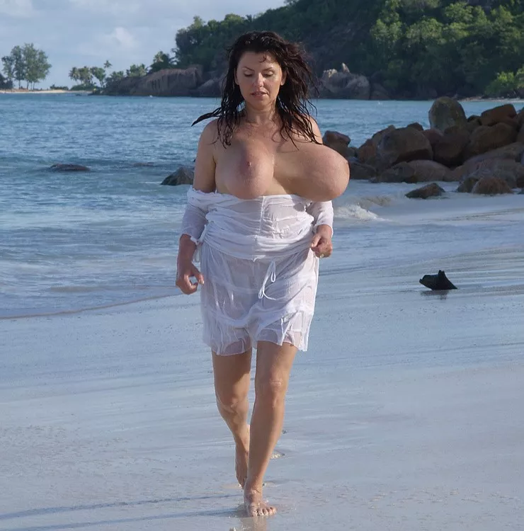 Milena proves it's possible to run at the beach with larger than average breasts ..... posted by milvelb