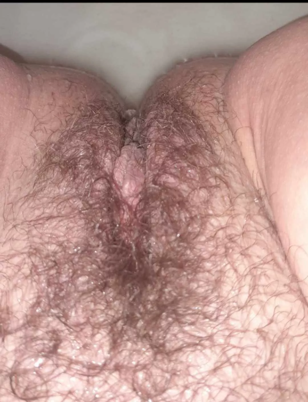 Showing off my hairy bush in the bath thinking it's time to trim posted by Dangerous-girl3