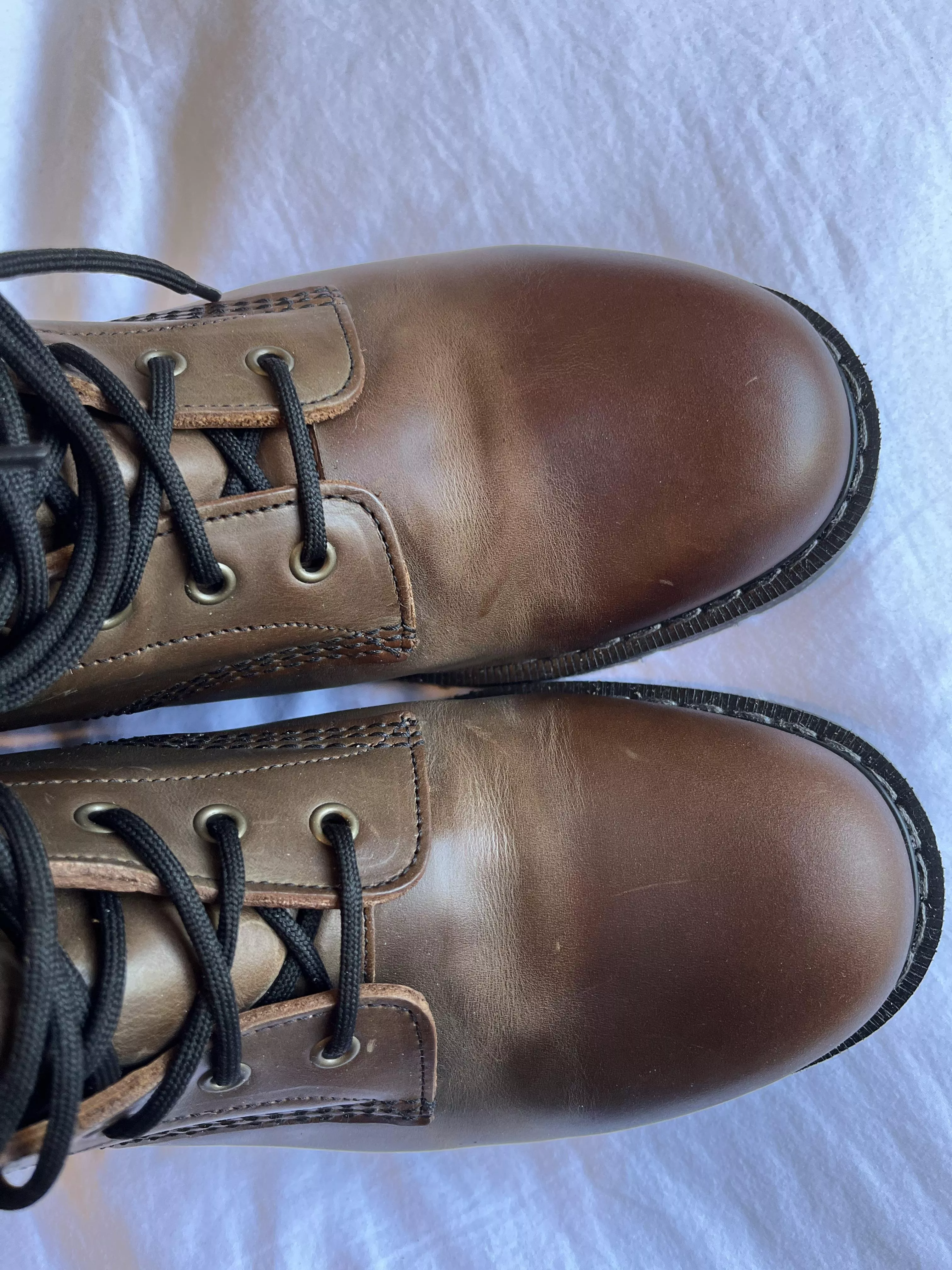 Does anyone know what causes this lighter area where toe cap bends ? posted by Ohnomycoco