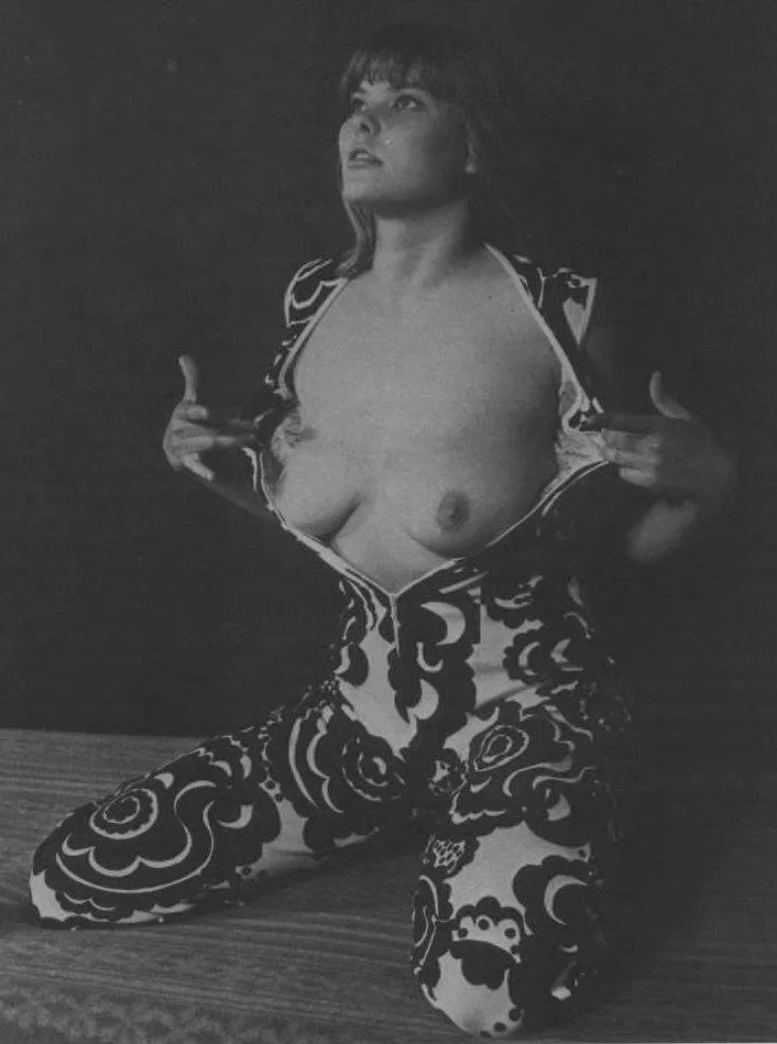 Unknown model unzips her patterned jumpsuit to expose her breasts [1970s] posted by html5gamerguy