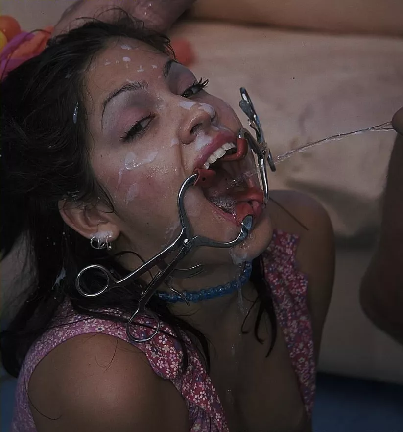 Face covered in cum with a mouth retractor in place. posted by DiggBoobs3
