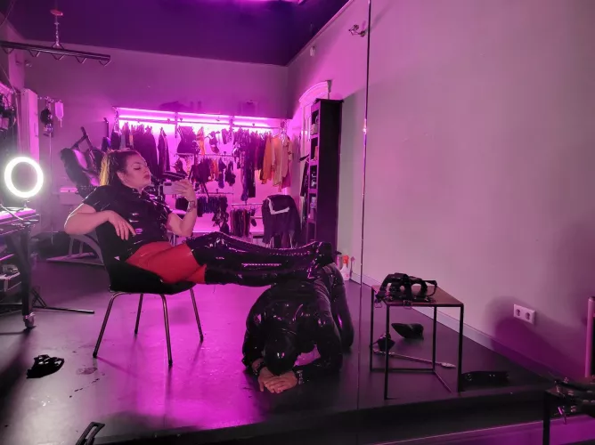 Human footstool in the dungeon for latex Mistress by LuxuriousSins