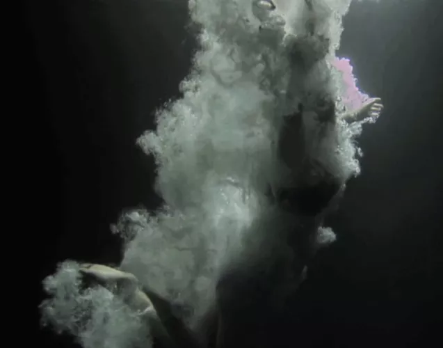 A pic of me jumping into the ocean one night in the moonlight by Final_Baby_9610