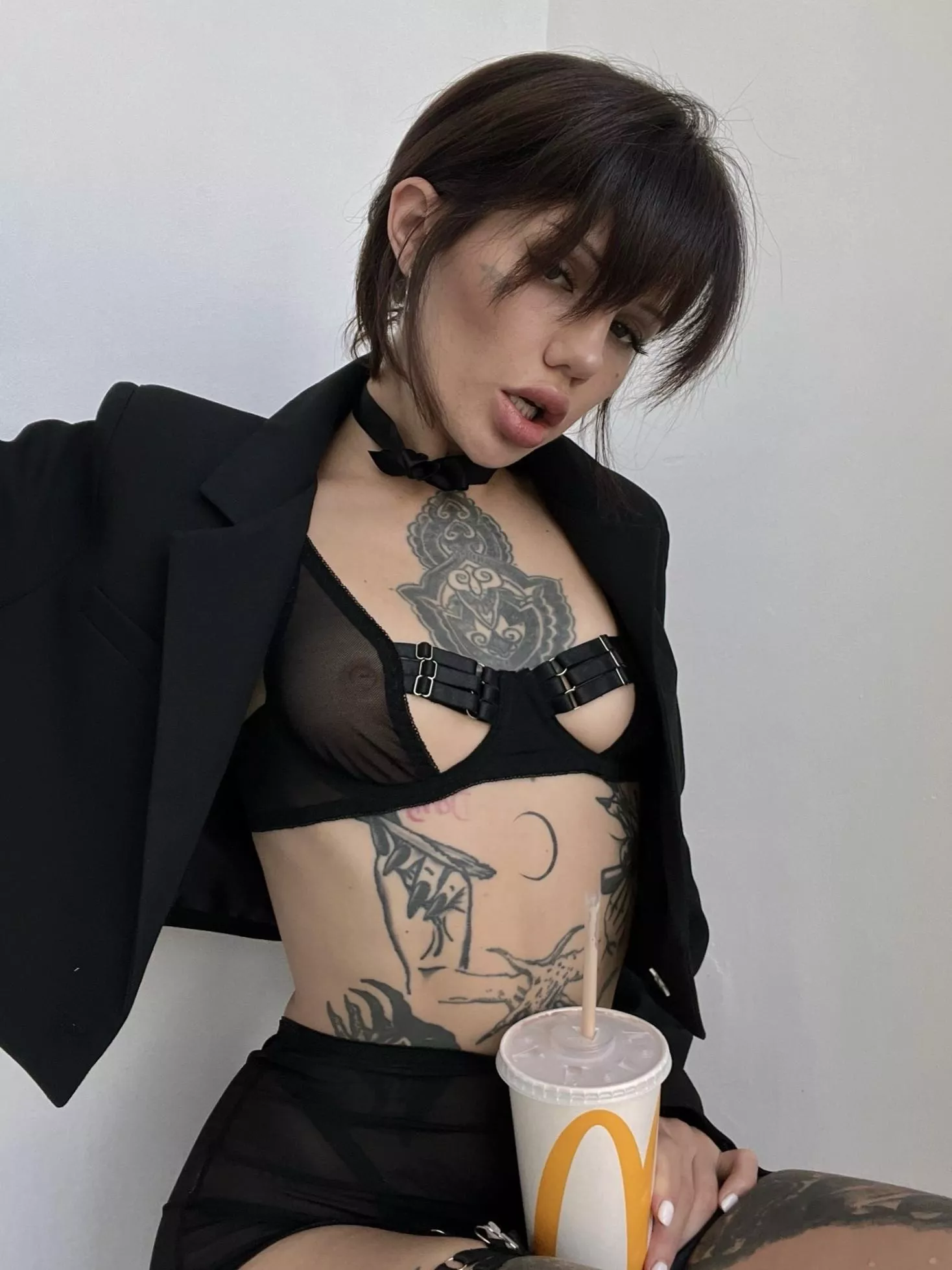 Serious woman loves Happy Meals and Coke posted by HuffilyBewilder