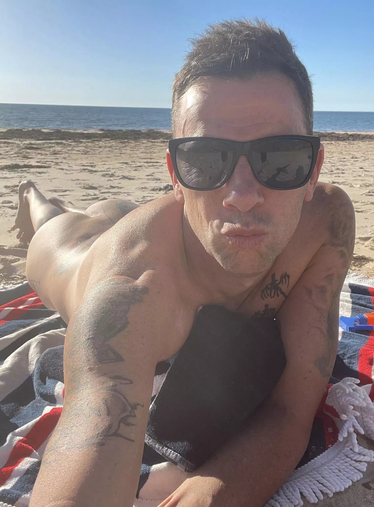 Nude at the beach posted by NakedRuss78