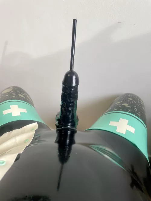 Enjoying to be covered into latex by Latexfucker