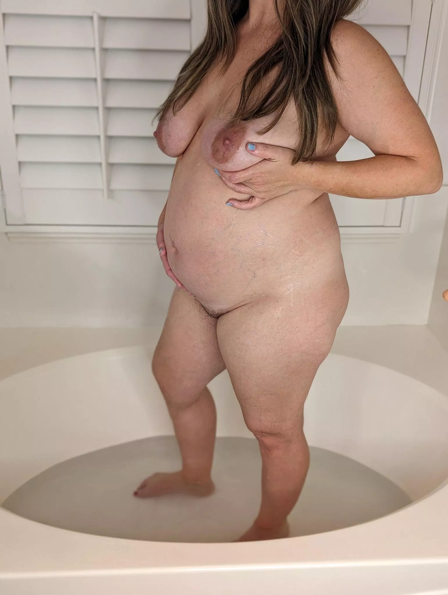 Dive into some naughty fun with this pregnant milf in the tub posted by FireAmy24